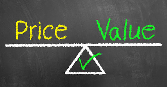 Price value balance drawing and text on chalkboard or blackboard as quality cost business product analysis concept