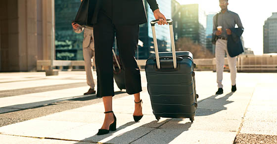 Man, woman and travel with work for corporate, professional and airport with luggage to plane. Formal, career and executives with luxury in first class and visa, booking and
